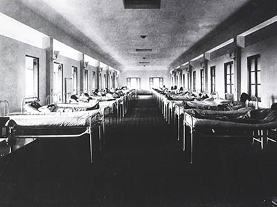 Black and white image of a segregated hospital treating Black patients